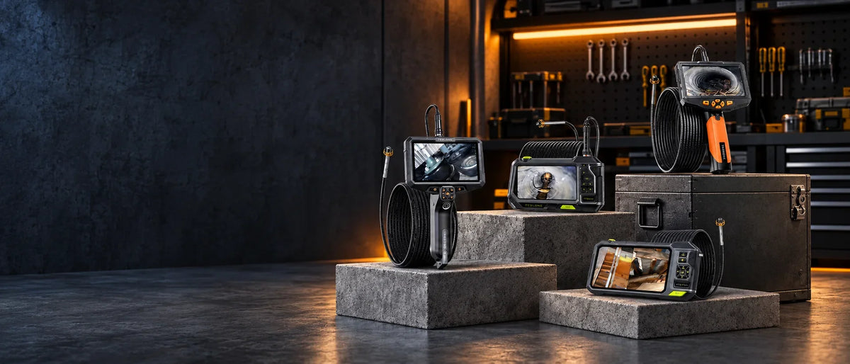 Teslong NTS300, NTS500, NTS600 and NTS700 dual rotating inspection cameras displayed in a dark workshop with orange accent lighting.