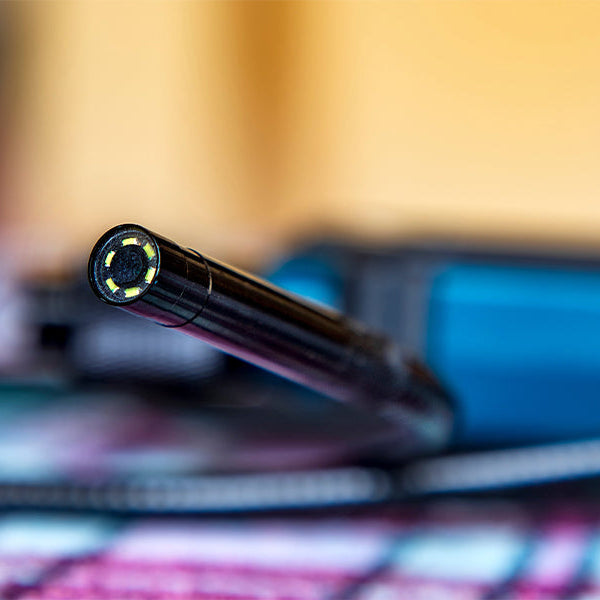 Close-up of a borescope camera probe with LED lights