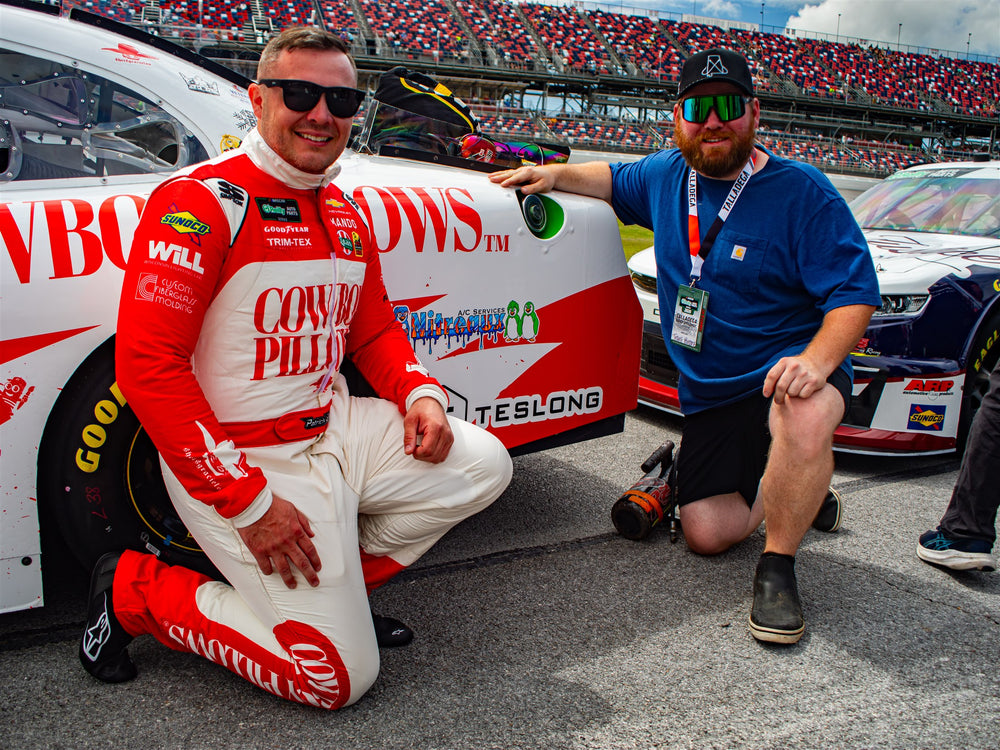 Patrick Emerling and team member beside the number 38 car