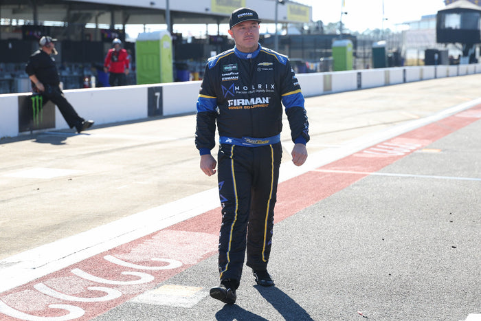 Patrick Emerling walking along pit road at Talladega · Photo: David Rosenblum / NKP