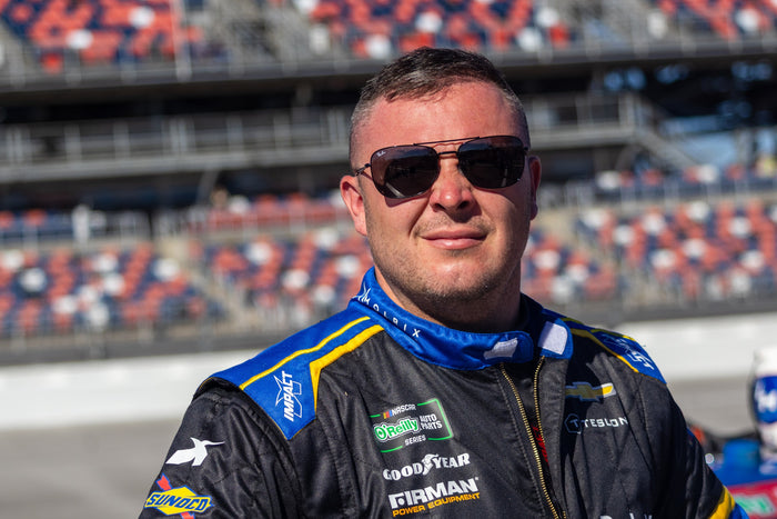 Patrick Emerling at Talladega with Teslong branding on his racing suit · Photo: LyleOnTrack