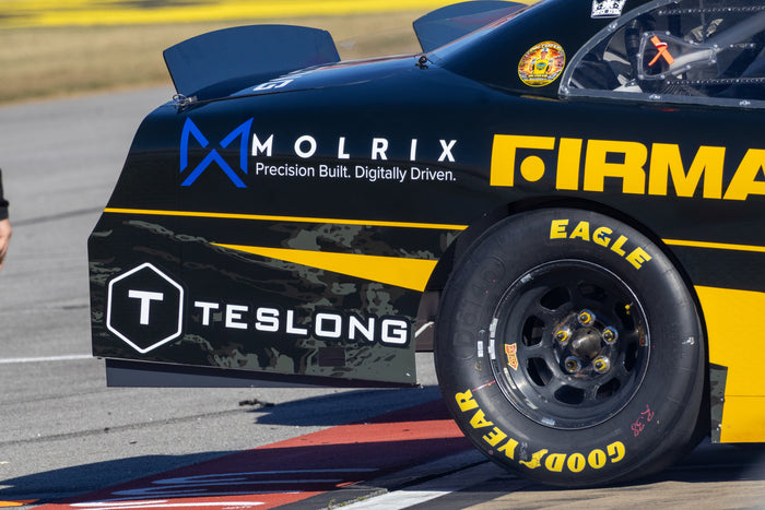 Teslong branding on the rear quarter of the No. 38 Chevrolet · Photo: LyleOnTrack