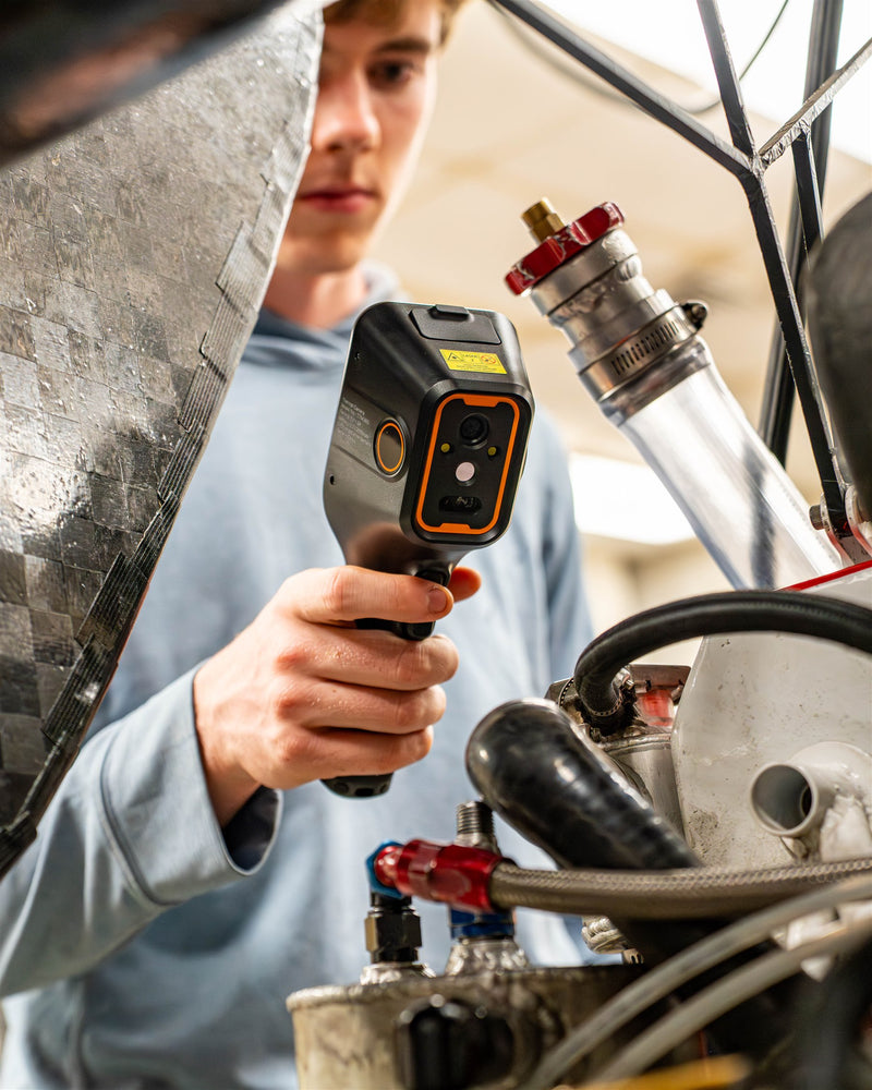 A Teslong borescope used for a closer view of vehicle components