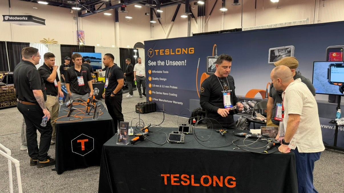 Teslong team demonstrating inspection cameras to visitors at SEMA Show 2025